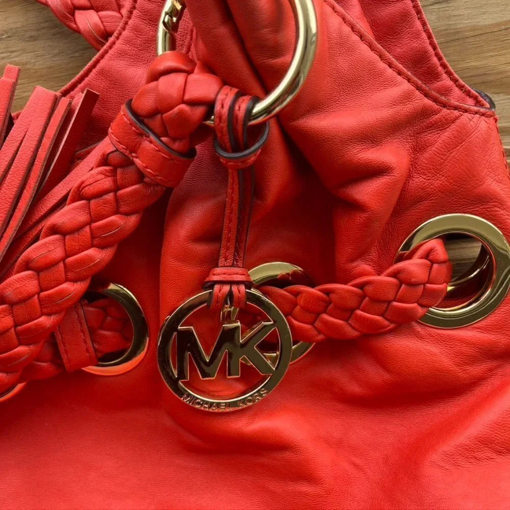 Michael Kors orange leather tassel hobo bag purse braided